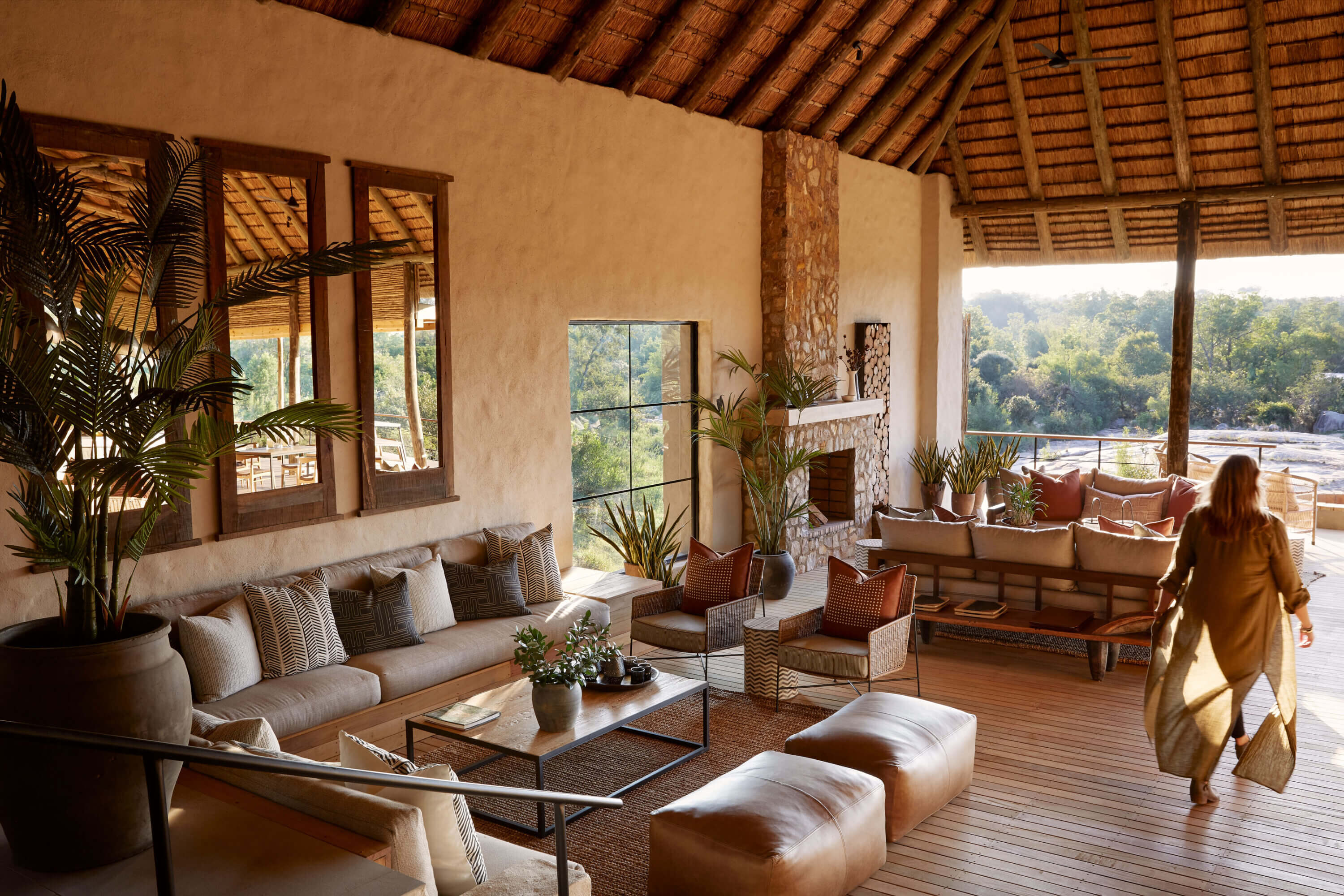 Person walks through the main area of Londolozi's Founders Camp